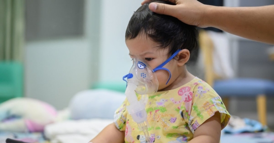 Toddler receiving a breathing treatment for RSV at Better Faster Urgent Care